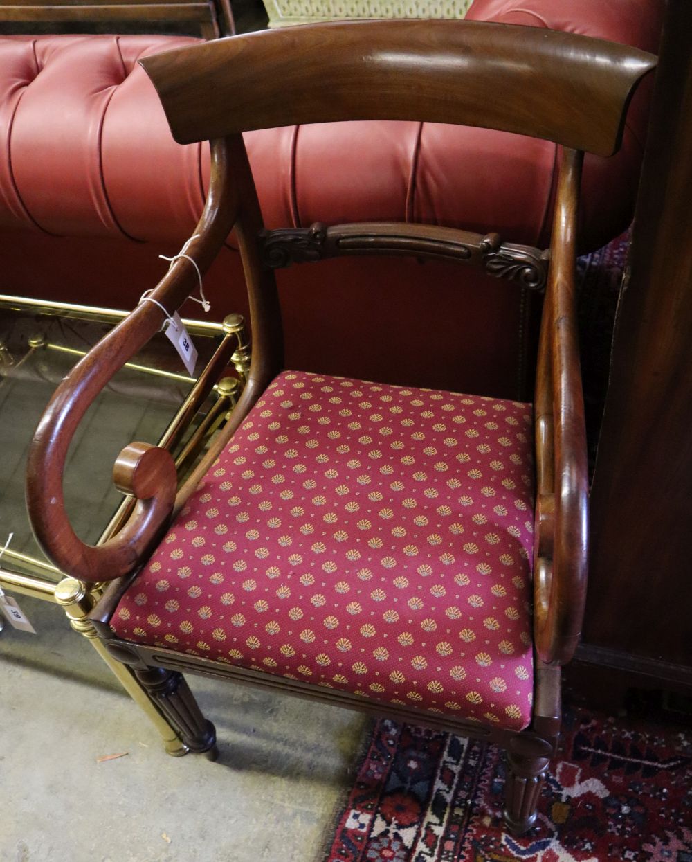 A William IV scroll arm elbow chair